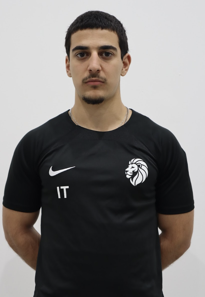 Ihsan Topuz — Coach at Alp Academy, wearing black Nike academy kit